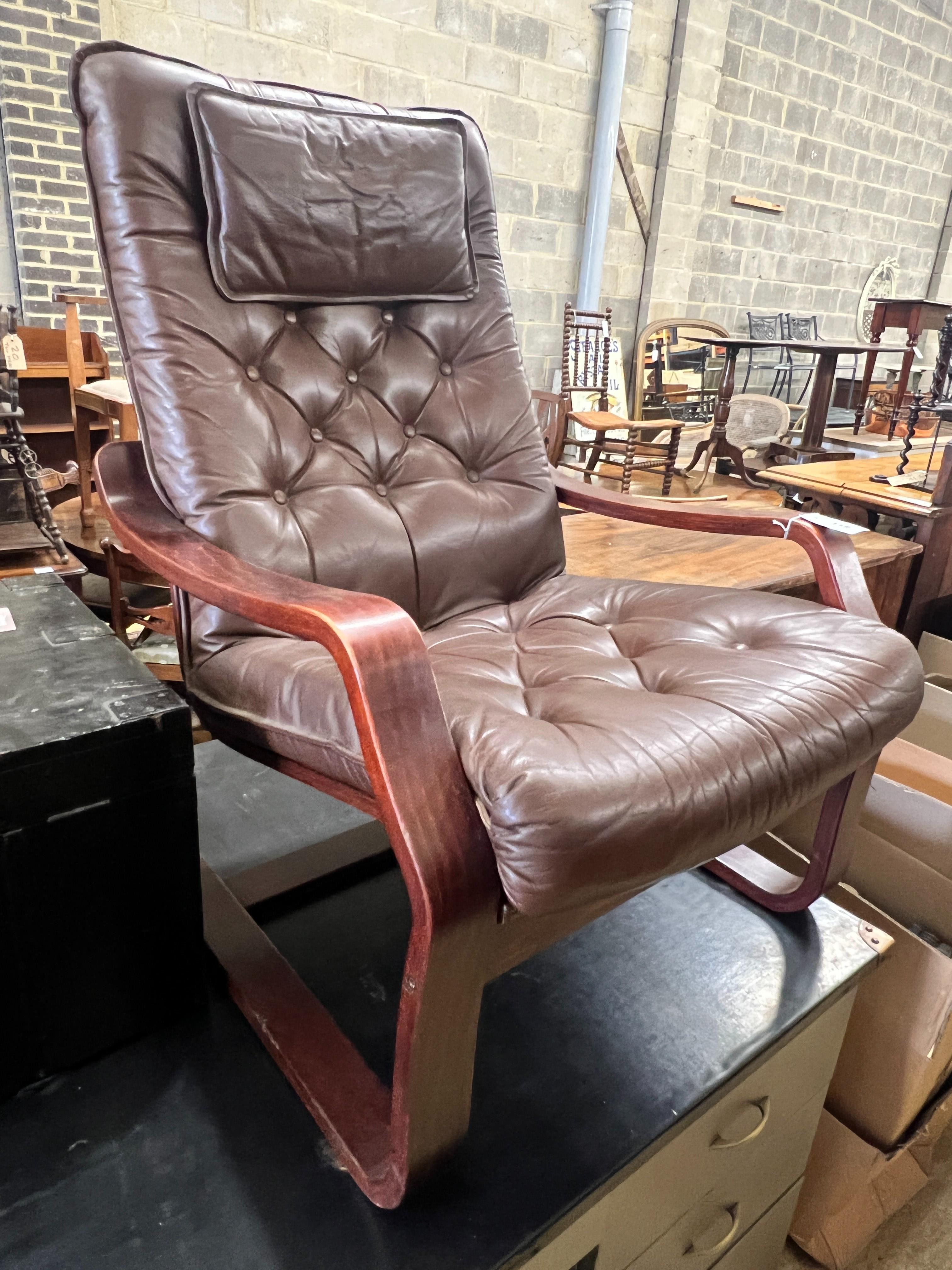 A 1970's Danish style buttoned brown leather and beech bentwood chair, width 69cm, depth 80cm, height 96cm